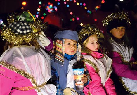 Children enjoy last year’s parade of lights. 