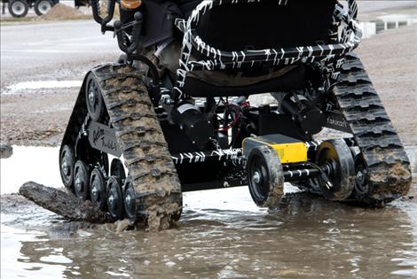 Tomy Parker’s new Action Trackchair powers through muddy terrain in Ronan Saturday.