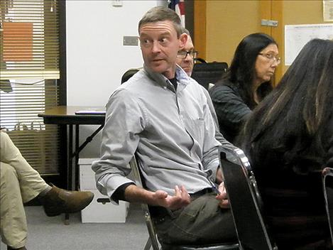 Tom Woolf, Aquatic Invasive Species bureau chief with Montana Fish, Wildlife and Parks, answers a question at the Nov. 12 Flathead Basin Commission meeting in Polson. 