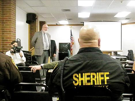 Jail Captain Joel Shearer, right, listens to Mark Martin during a town hall meeting about a jail assessment on Friday.