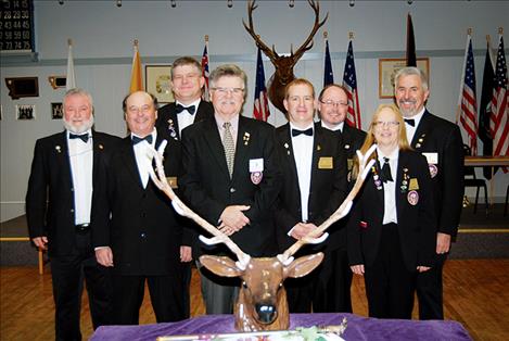 Elks who recently commemorated departed members include (front): Mike Speckert Esquire, Bob Byers, Chad Komlofske Exalted Ruler, Stephanie Hart Lecturing Knight and (back) Jeff Megahan Secretary, David Rensvold Chaplin, Dan Dewitt Leading Knight, Jeff Andrews Loyal Knight.