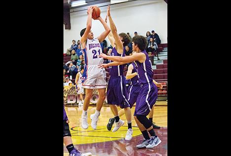  Mission Bulldogs Wacey McClure aims for the hoop.  