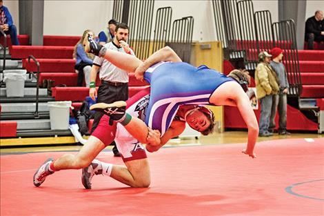 Arlee Warrior George Shick upends opponent.