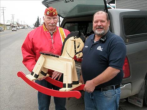 POLSON – Six local youths will likely be having a rockin’ good time this holiday season thanks to the gift of rocking horses through Toys for Tots. The Marine Corps League’s local Hellroaring Detachment will be distributing the gifts this week thanks to the efforts of Western Building Center and local industrial arts and art students. Brian Moldenhauer, a WBC employee, got the idea to donate materials for the rocking horses from Eric Marten, the manager of the WBC store in Columbia Falls who has been involved in a similar project.  “I pushed the ball a little farther down the court,” Moldenhauer said last week. “It’s a way for WBC to give back to the community. I think it’s a good deal all the way around the block. Students learn from it and recipients get the enjoyment.” WBC donated the paint and wood, and Brad Paskey and Steve Davey had some of their industrial arts students at Polson High and Polson Middle schools make the rocking horses.  Matt Holmes and about 10 of his art students at Polson High School painted and decorated the horses. “The students really enjoyed the building and painting process,” Holmes said, noting that some asked if they could help when they saw them in class.  The art students and Holmes painted the horses and made canvas ears, yarn tails and fabric buttons for them.  “It was a great experience to have the kids create something for someone else,” Davey said, noting that 12 of his middle school students got to hone their skills in the process. “They could see the relevance of turning some raw materials into something else.” Davey said his class looks forward to helping with the project next year. “It’s a win-win,” he said. 