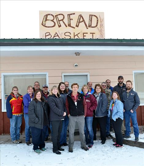 St. Luke Community Healthcare personnel from winning departments of Human Resources, IT, Materials Management and Maintenance pose for a photo after collecting the most money and food for local food pantries during a recent holiday food drive.