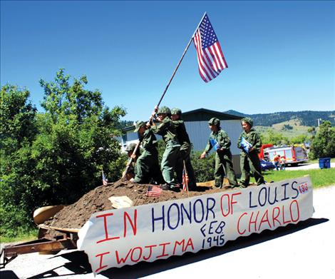 The Morin family and friends pose as the famous Iwo Jima memorial during Arlee's Fourth of July parade.