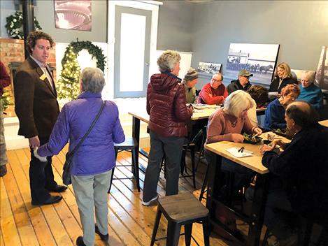 Congressional candidate John Heenan, left, talks with folks on Dec. 11 at Blodgett Creamery Coffee Saloon.
