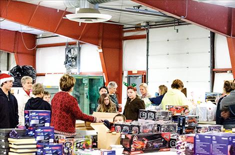 Mission Middle School students visit the Share the Spirit warehouse in Polson to drop off gifts.