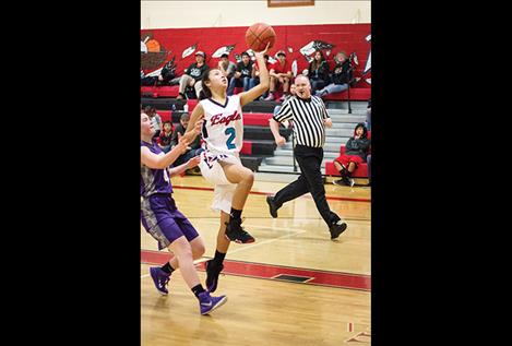 Lady Eagles Ce’ Alana Shepard slips past a Lady Viking defender.