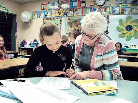 Foster grandparent Robin Burland regularly volunteers at Linderman Elementary School. Burland has said that even if the program ends, she’ll continue to come help at the school. 