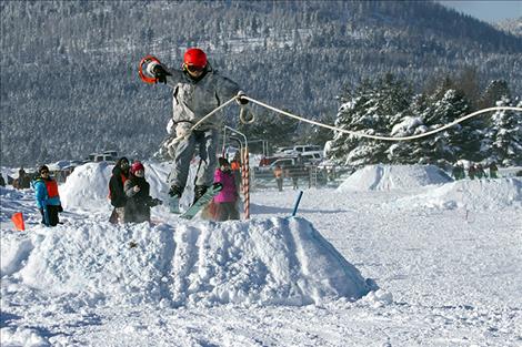 Skier Chris Alfiero is pulled by Chica, ridden by Erica Alfiero.