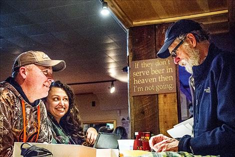 Prospective owners and steering committee member Heidi Fleury share conversation during a Dec. 2  ownership drive that raised more than $26,000 for Montana’s first coop-owned brewery.