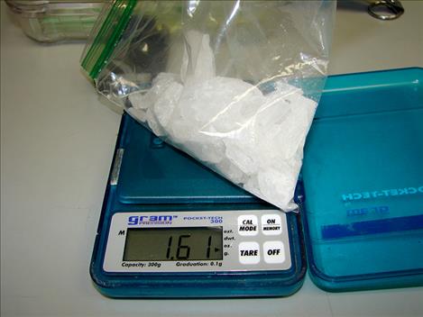 Nearly a half pound of methamphetamine and $1,000 in cash was seized in the bust.