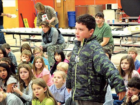 Third-grader Cameron Buxton stands up among his peers to answer the question, “What is discipline?”