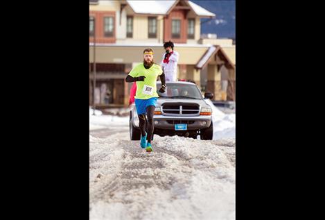 Overall winner Michael LaForest sprints through slush on Polson Hill.