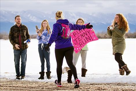 The Straub family cheers on longtime friend Jenny Whitaker. 