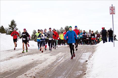  Racers begin the chilly 13.1-mile run. 