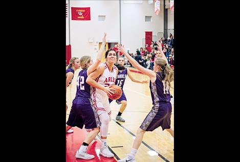 Arlee Scarlet Alyssia Vanderburg makes a move toward the basket while tallying a double-double against Charlo.