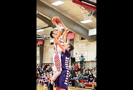 Warrior Lane Johnson shoots over a Viking  defender.