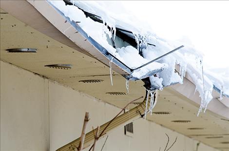 The elementary school rain gutters were damaged from melting snow.
