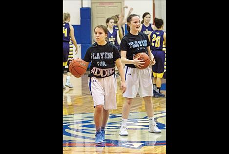 During warm ups the Lady Bulldogs show their support for injured teammate Addison Arlint.