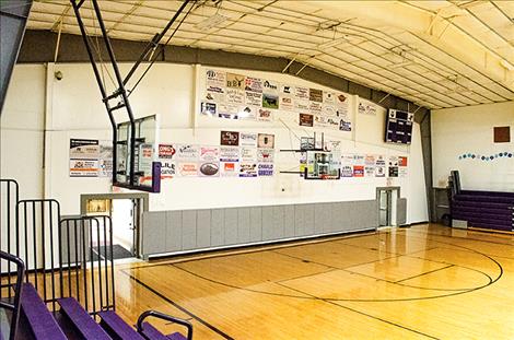 Signs, purchased by businesses and individuals, are helping to support the development of the Charlo School District’s outdoor complex. The signs are displayed in the gym.