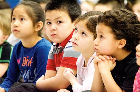 Pablo Elementary School students listen to James Spencer play a soft sounding flute during the morning.