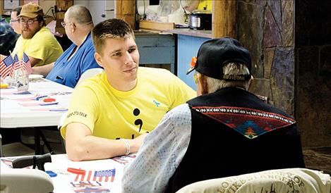 Army veteran Jeff Newton talks to other veterans during the event. 