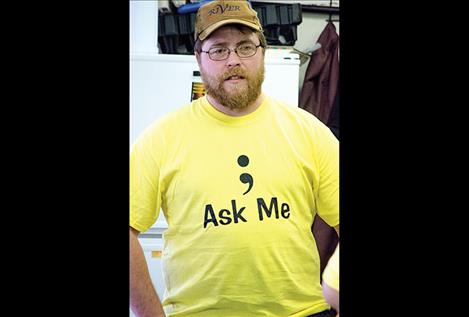 Army veteran Justin Blevins wears one of the "Ask Me" shirts created by the Your Life Matters Project volunteers to bring awareness to suicide issues.