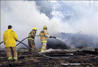 Grass fire destroys trailer house