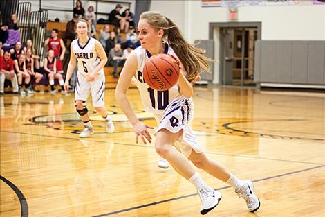 Charlo's Kaitlin Cox races to the hoop.