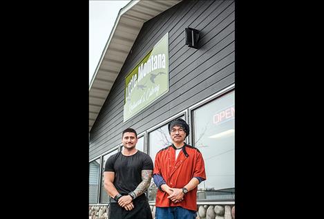 Owners of Little Montana, Sean Perry and Guy Hill, stand at the entrance of their new restaurant. 