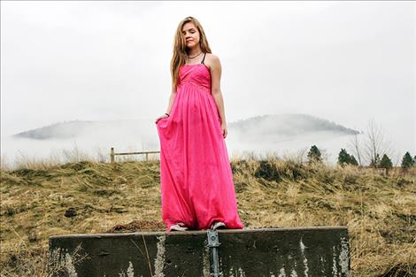 Sierra L. Mattson stands near the old Dixon Agency during  a photo shoot.