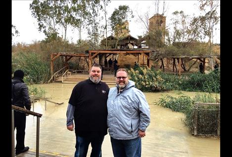 Pastors Jason Burrough and Chriss Sopke stand on the banks of the Israeli side of the Jordan River.