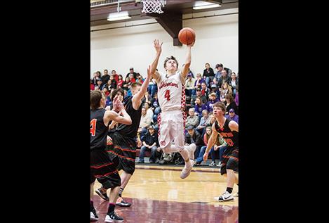 Arlee Warrior Will Mesteth slips past defenders for a score.