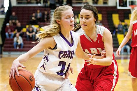 Lady Viking Carlee Fryberger battles her way to the hoop.