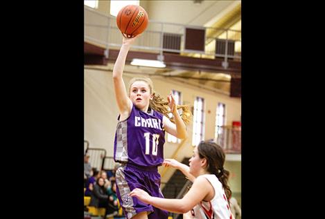 Lady Viking Kaitlin Cox shoots a jumper over a Hot Springs defender during district tournament play.