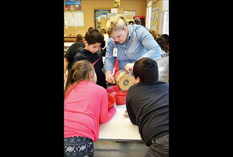 News from St. Luke Community Healthcare RONAN – St. Luke is teaming up with the Boys and Girls Club of the Flathead Reservation and Lake County to promote healthy lifestyles to local youth. Registered Dietician Jenny Robey is teaching cooking classes at both the Ronan and Polson Boys and Girls Clubs. The lessons empower young people to prepare their own nutritious foods. “The idea is to make a curriculum that’s really fun for the kids,” Robey said. The partnership arose from St. Luke’s 5210 program, which promotes healthy behavior in children. The program informs families that each day children should eat 5 fruits and vegetables, limit recreational screen time to 2 hours, actively play for at least 1 hour, and consume 0 sugary drinks. The cooking classes at the Boys and Girls Club are part of efforts to extend the reach of the 5210 initiative to all children in Lake County.  The 5210 mission aligns with a health education program being implemented through Boys and Girls Club. The program is called Together Raising Awareness for Indigenous Life (TRAIL). The program works to reduce the prevalence of type 2 diabetes in Native American youth. Boys and Girls Clubs on Indian reservations across the country implement the healthy lifestyles program. Amy Vaughn, director of operations for the Boys and Girls Club of the Flathead Reservation and Lake County, teaches the TRAIL program in Polson and Ronan. She said that 60 percent of the members of local club self-identify as Native American, which makes them eligible for the program. Vaughn believes that the program will have a positive impact on all of its participants. “This is all about prevention,” she said. “We want to teach healthy lifestyles and habits so that they can make good choices.” St. Luke’s cooking classes fit into the healthy eating part of the curriculum. On the first day of cooking class in Polson, children filed expectantly into the room for their lesson. Hummus was the recipe for the day. Robey held up a bag of chickpeas and explained that they would use them to make their healthy snack. None of the children had tasted hummus before, but they were enthusiastic about preparing it. They blended the chickpeas with seasoning in a food processor to make a thick dip. The children made enough hummus for the rest of the club to eat it for snack the following day. Then they each tasted vegetables dipped in their hummus. In future classes, children will learn to make granola and salsa and can share their culinary knowledge with their families at home. Families will also receive information about connecting with St. Luke doctors to keep their children healthy through the 5210 program.  Robey asserts that hands-on cooking lessons are an effective way to steer children toward a healthier diet. “Discussing what a healthy diet and active lifestyle might look like with families is important, but it’s just as important that children and families have the skill set to prepare nutrient dense meals that set them up for success,” she said.  For more information about St. Luke Community Healthcare’s 5210 program call Brooke Duty at 406-528-5262. Amy Vaughn with the Boys & Girls Club can be reached at 406-676-5437.