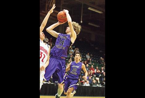 Polson Pirate Robin Erickson shoots a jumper over Browning defender.