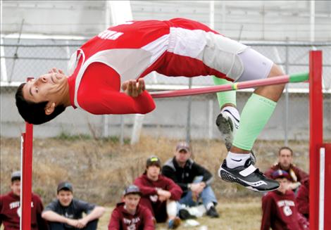 Warrior PJ Haynes clears the high jump  during competition at the Ronan Invitational track meet last week.