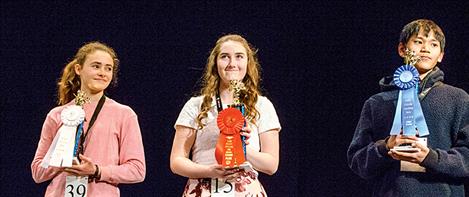 Winners hold their trophies. They include, from left, Taleah Hernandez, third place; Molly Kate Sullivan, second place; and John Paca, first place.  