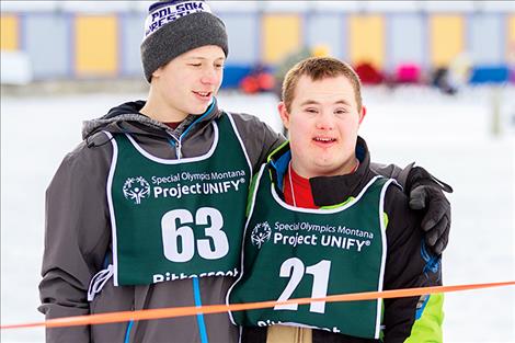 Kedrick Baker and Dothan Stene share a hug and a smile during a break between races.