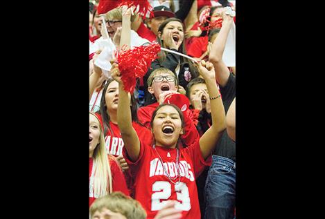 Fans cheer on the Warriors.