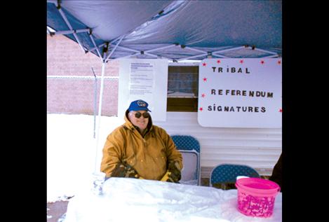 People’s Voice Vice President Eldon White braves the snow to collect signatures.