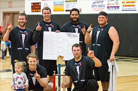 Ronan Spring Sports Dodgeball Tournament  Champions “The Dodge Fathers” show off their trophy.