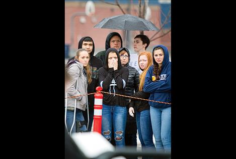 Ronan High School students react to a mock crash scene during a Ghost Out event.