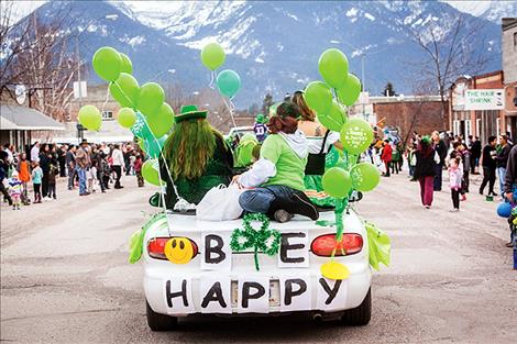 With the majestic Mission Mountains as a backdrop, children and adults line Main Street in Ronan for the annual St. Patrick's Day parade.