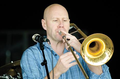 John Roberts performs for the children.