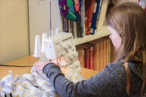 MVCA student Keri Stutzman sews her blanket.