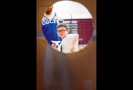 Elijah Bell takes aim in one of the many carnival style games.